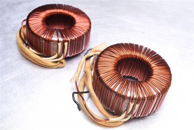 Copper Coils Transformer On Metal Background